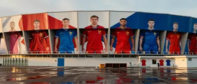 A dramatic semi-final moment on a pristine stadium pitch, two anonymous players locked in a fierce duel: one in plain...
